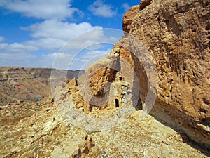 Ancient cliff dwellings in the Sahara Desert of North Africa