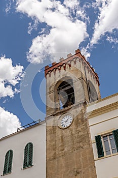 The ancient clock tower of the Palazzo del Capitano del Popolo in Piazza Mazzini square, Castiglione del Lago, Italy