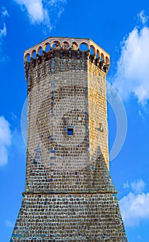 The ancient clock tower, symbol of the ancient village of Marta, on the shore of the Bolsena Lake in Italy.