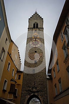 ancient clock tower in vipiteno old town photo