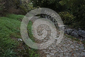 Ancient cobblestone road in a medieval village in Portugal photo