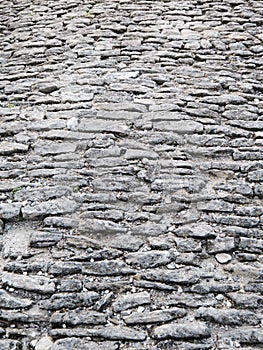 Ancient cobblestoned pavement background photo