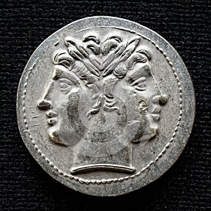 Ancient coin showing two-headed Roman god Janus, 225-214 BC photo