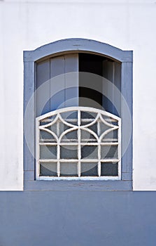 Ancient colonial window in Serro, Minas Gerais, Brazil photo