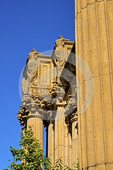 Ancient colosieum or temple in the old world with roman style design in late afternoon sun with orange clay color