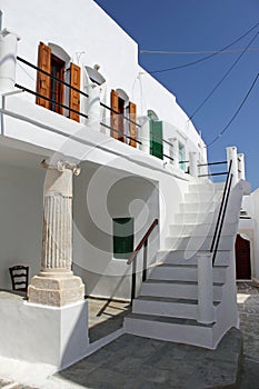 Ancient column is used to support the upper part of a house in Kastro traditional village, Sifnos island, Greece.