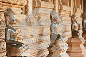 Ancient copper Buddha statues located outside of the Hor Phra Keo temple in Vientiane, Laos.
