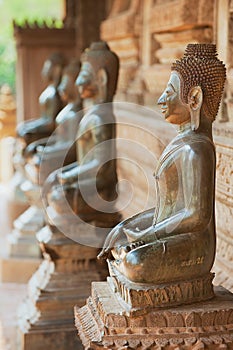 Ancient copper Buddha statues located outside of the Hor Phra Keo temple in Vientiane, Laos.