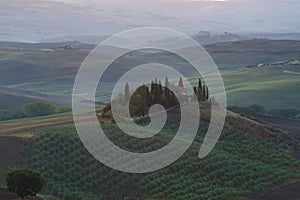 An ancient country house the Belvedere on the hills of Tuscany in the early September morning