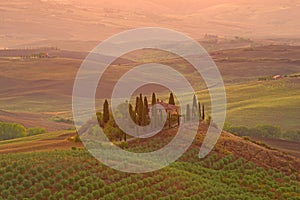 An ancient country house in September dawn. Neighborhood of the city of Val d`Orcia, Italy