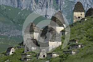 Ancient crypts The City of the Dead Dargavas on a summer day. North Ossetia, Russia photo