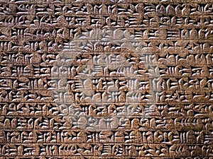 Ancient cuneiform writing script on the wall