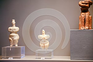 Ancient cycladic figurines in museum in Athens