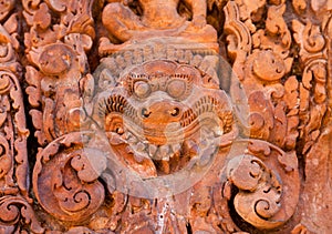 Ancient daemon carving on the wall