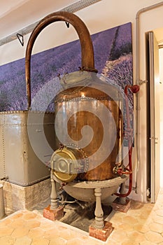 Ancient distiller for the production of perfume in Fragonard factory in Grasse, France photo