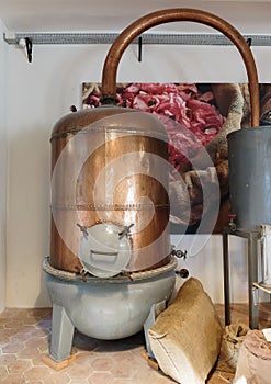 Ancient distiller for the production of perfume in Fragonard factory in Grasse, France photo