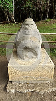 An ancient `doble yo` sculpture. An anthropo-zoomorphic form at San Agustin archaeological park. photo