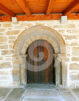 ancient door of a church in rural landscapes