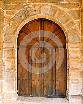 ancient door of a church in rural landscapes