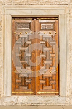 The ancient door in the courtyard of the Blue Mosque in Istanbul, Turkey