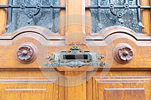 Ancient door handle on the door to the house