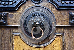 An ancient door handle with metal lion head in Tbilisi, Georgia