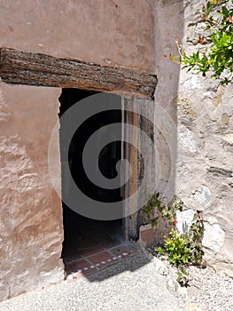 Ancient door with wood lintel in Carmel Mission museum photo