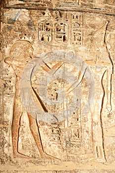 Ancient Egyptian hieroglyphic carving in Medinet Habu