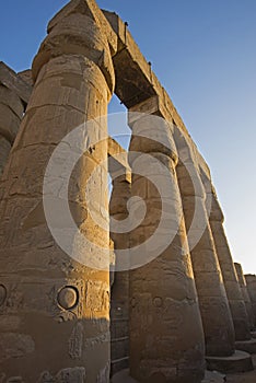 Ancient egyptian hieroglyphic carvings on columns in temple