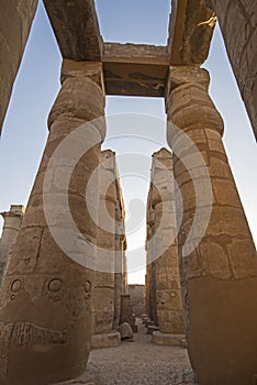 Ancient egyptian hieroglyphic carvings on columns in temple