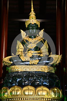 Ancient Emerald Buddha statue or Phra Kaeo Morakot for thai people travelers travel visit respect praying blessing wish holy