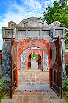 Ancient entrance gates with red doors to the Citadel. Imperial City Hue, in the Forbidden City of Hue.