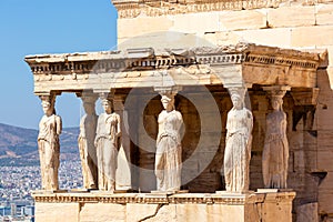 Ancient Erechtheion or Erechtheum temple with Caryatid Porch on the Acropolis, Athens, Greece. World famous landmark at the