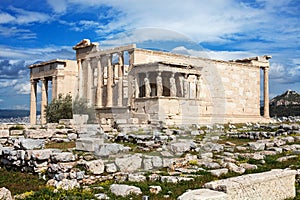 The ancient Erechtheion temple with the Caryatid pillars on the porch, at the Acropolis