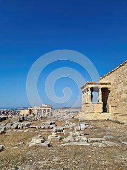 Ancient Erechtheion temple with Caryatid Porch on Acropolis, Athens, Greece. Famous Acropolis hill is top landmark of Athens.