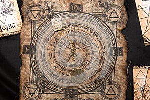 Ancient esoteric witchcraft background. Occultims and paganism old symbol, with mysterious runes alphabet
