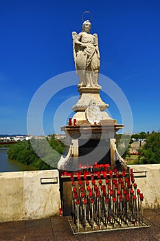 Ancient female sculpture on the Puente Romano. Cordoba, Spain