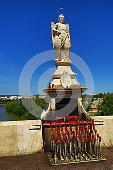 Ancient female sculpture on the Puente Romano. Cordoba, Spain photo