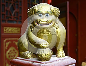 Ancient figurine of funny lion in chinese taoist temple