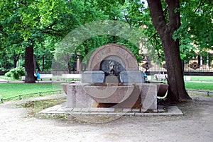 The ancient fountain of 1809 stands in Voronikhinsky Square, near the Kazan Cathedral. Summer city landscape. Historical places.