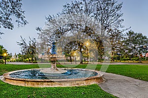 ancient fountain in a beautiful evening garden, Ai generated