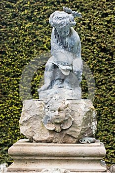 Ancient fountain of boy and fish in Glamis photo