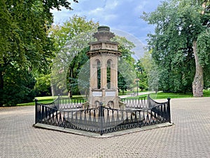 An ancient fountain in the park in the Teplice