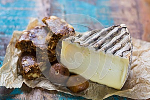 Ancient french cheese Tomme de Montagne and dried figs with figs photo