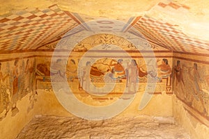 Ancient frescoes decorating etruscan tomb in Italy