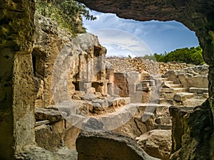 Ancient funerary caves hollowed out in a natural rock. photo