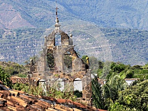The Ancient gabled church tower with bells in Barichara, Colombia