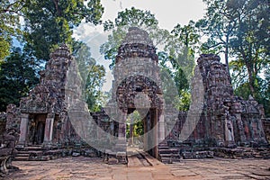 Ancient gate of Preah Khan the stone temple surround with forest