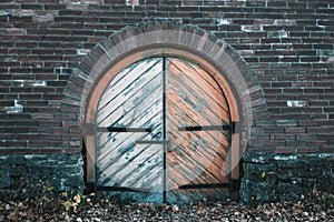 Ancient gate to the barracks with a hanging lock