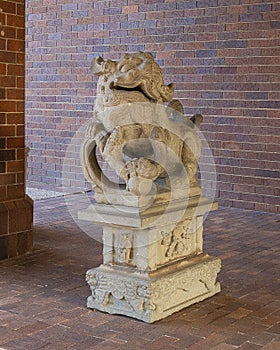 Ancient gaurdian Chinese foo dog at an entrance to the Anatole Hotel in Dallas, Texas.